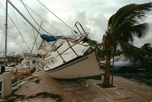 A sailboat sits on a sidewalk at Dinner Key in Miami after it was washed ashore by Hurricane Andrew - Aug. 24, 1992